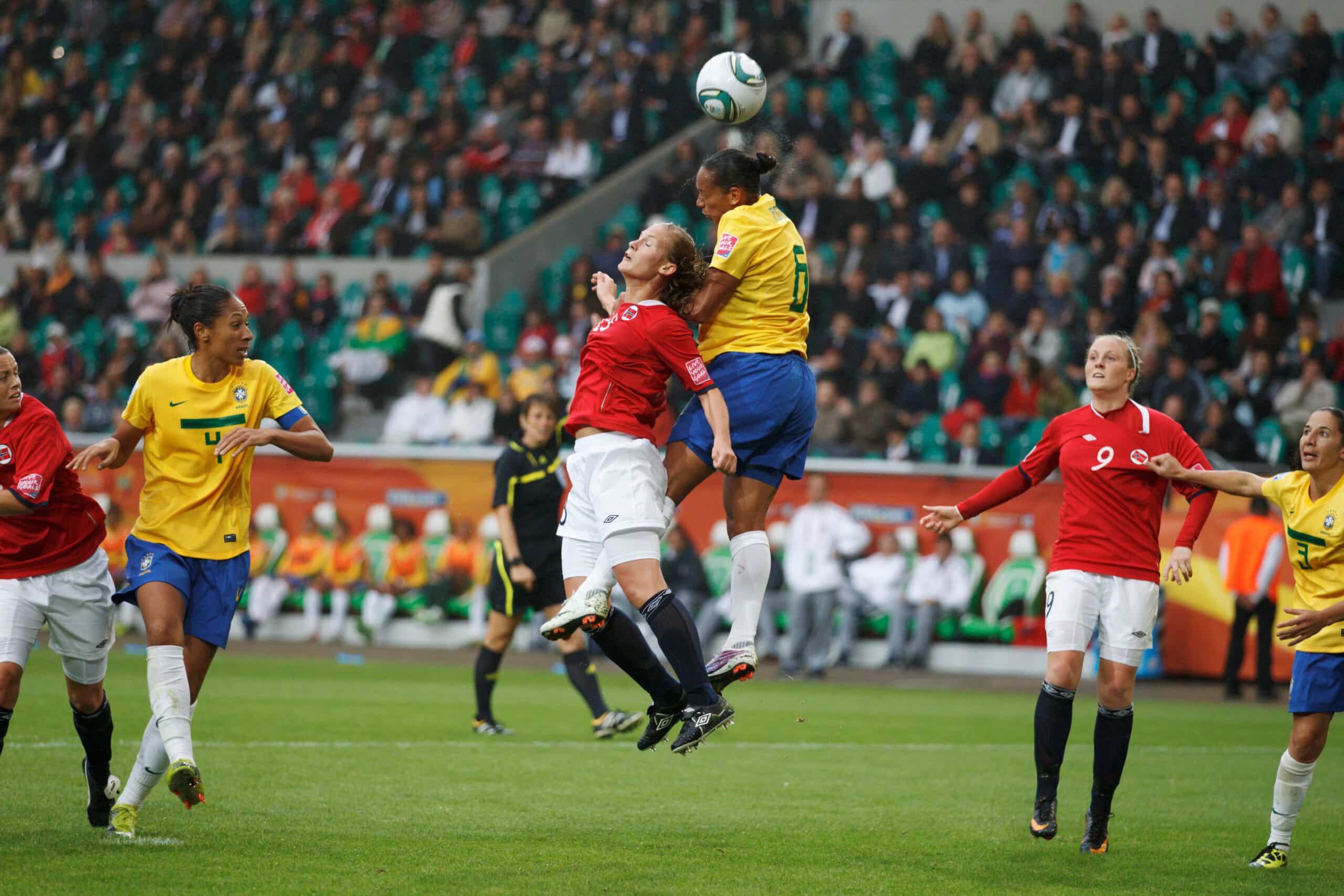 Madeleine Giske of Norway (l) and Rosana of Brazil (r) jump for the ball during a FIFA Women's World Cup match July 3, 2011.